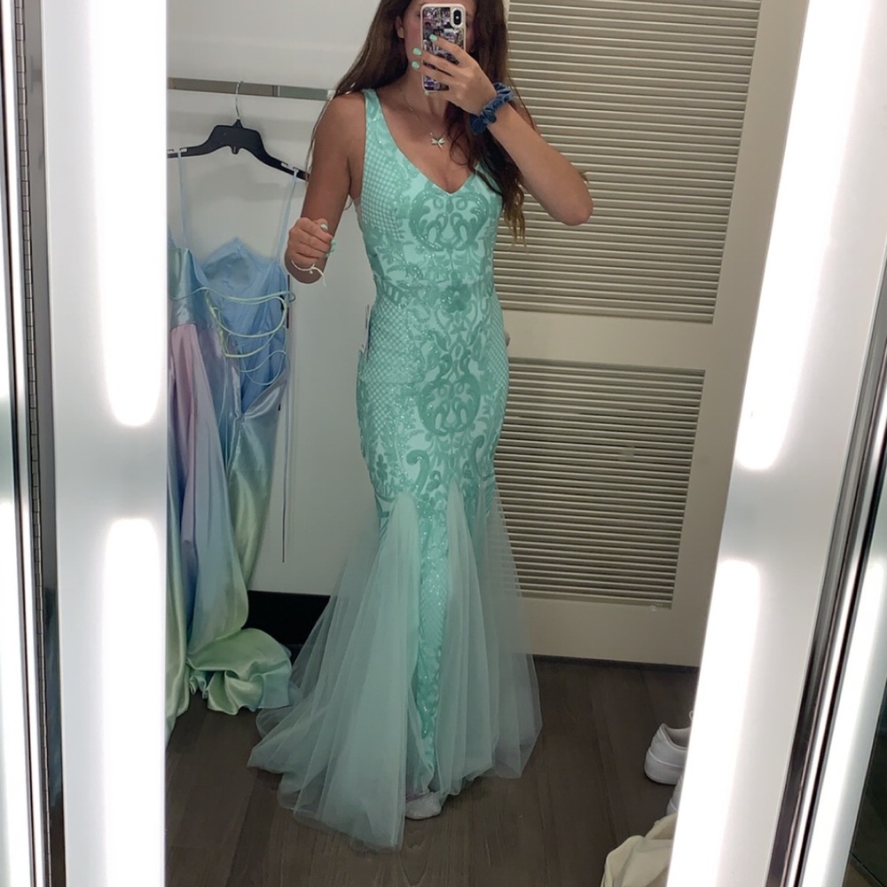 Aqua floor-length mermaid style dress. From Macy’s, by the brand Teeze Me.